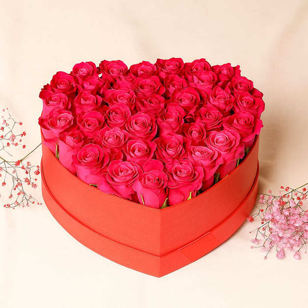 باقة ورد جوري وردي داكن في بوكس شكل قلب