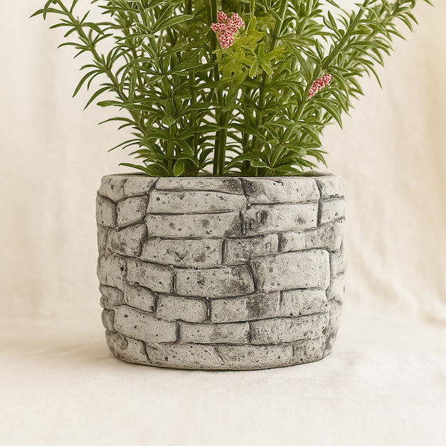 نبات مزهر صناعي أصيص حجري